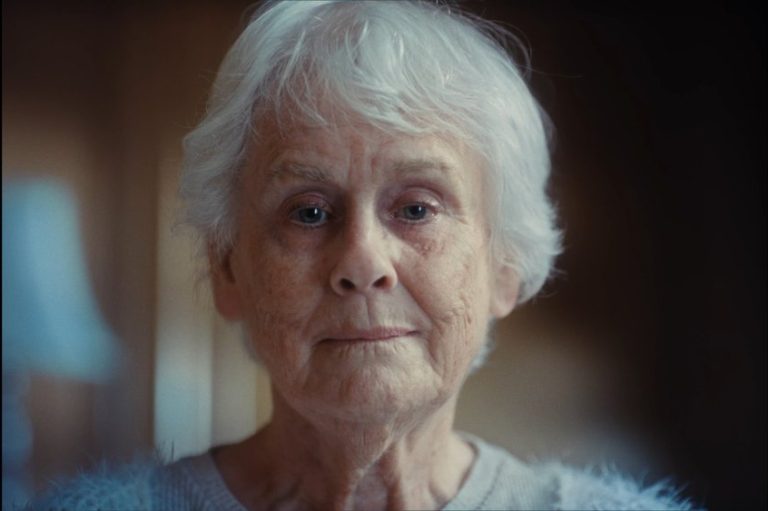 Elderly woman stares into the camera in January 19th