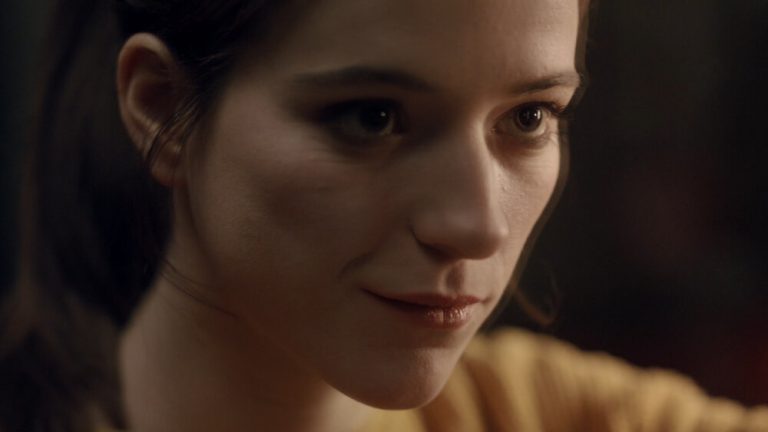 Close up of woman looking into a mirror