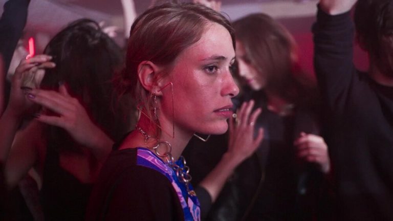 Woman is stopping and looking back before leaving club