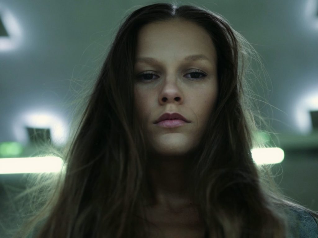 Close up of model looking into camera.