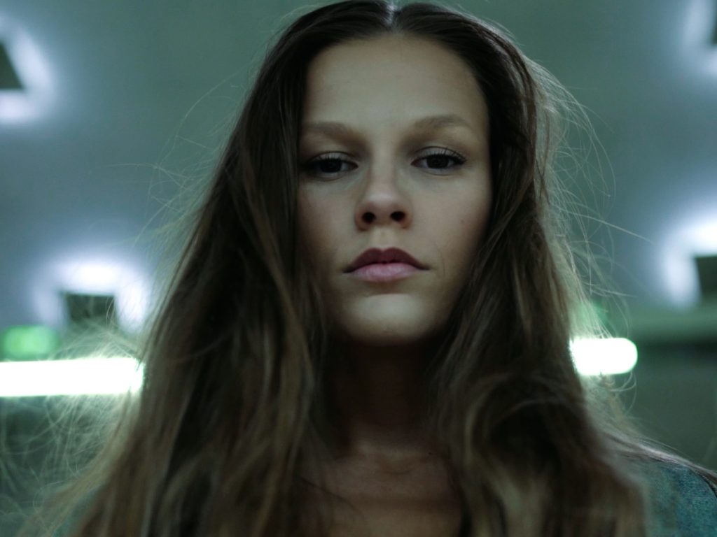 Close up of model looking into camera.